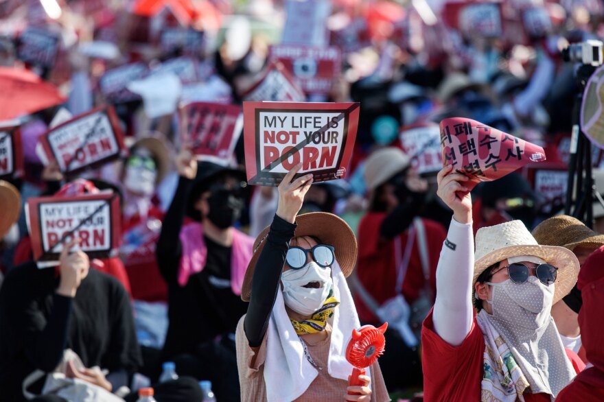 Some 70,000 women in August gathered in central Seoul, holding signs saying, "My life is not your porn." It was the fourth protest this year condemning the prevalence of hidden-camera crimes.