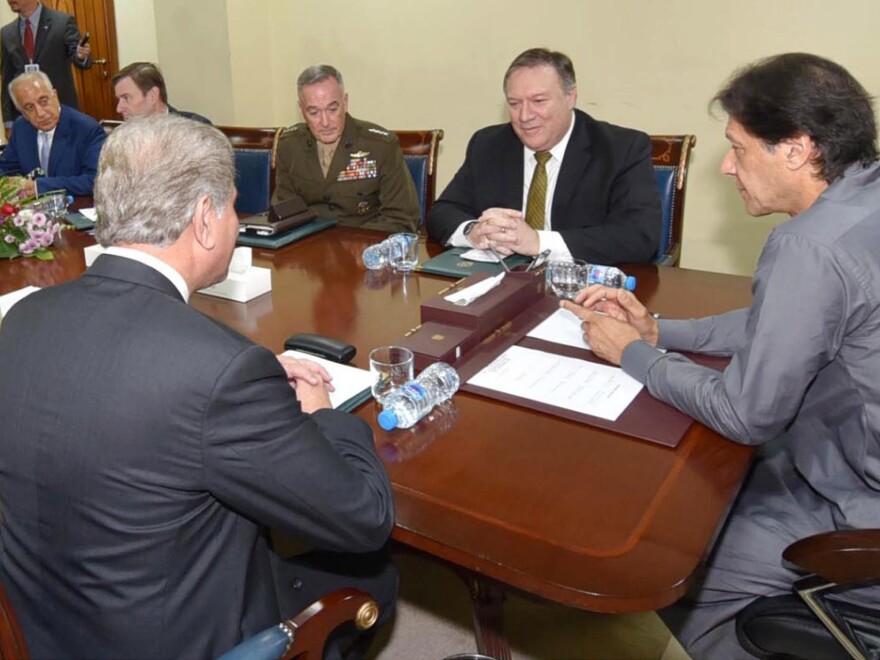 In this photo released by Press Information Department, Pakistan's Prime Minister Imran Khan (right) meets with Secretary of State Mike Pompeo in Islamabad on Wednesday. 2018. Khan said he was "optimistic" he could reset the relationship with Washington after the U.S. suspended aid over the country's alleged failure to combat militants.