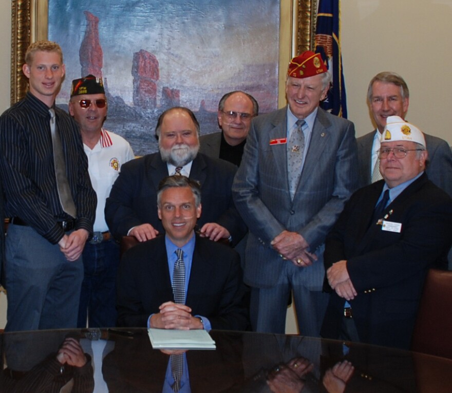 A photo of Christofferson with other veteran advocates and former Gov. Jon Huntsman.