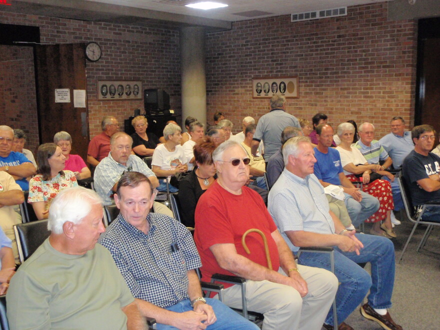 Residents wait for a zoning board meeting to consider a permit for a mosque in Mayfield.