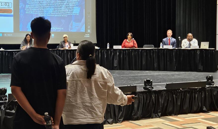 Former Buffalo Public Schools Board of Education Member Jennifer Mecozzi, front-right, addresses current school board members during a BoE meeting.