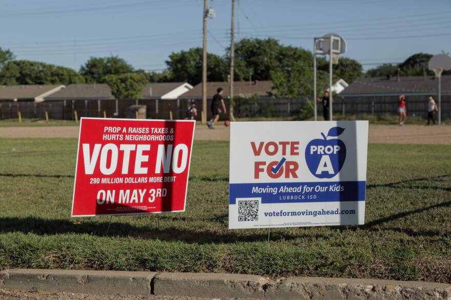 Bond election signs outside of the vote center at Parsons Elementary School, May 3, 2025.