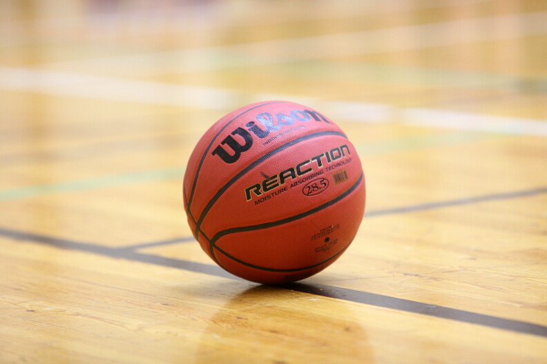 A basket ball on a court.