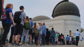 People wait in line to buy viewing glasses for the eclipse at the Griffith Observatory in Los Angeles early Monday, Aug. 21, 2017. (Richard Vogel/AP)