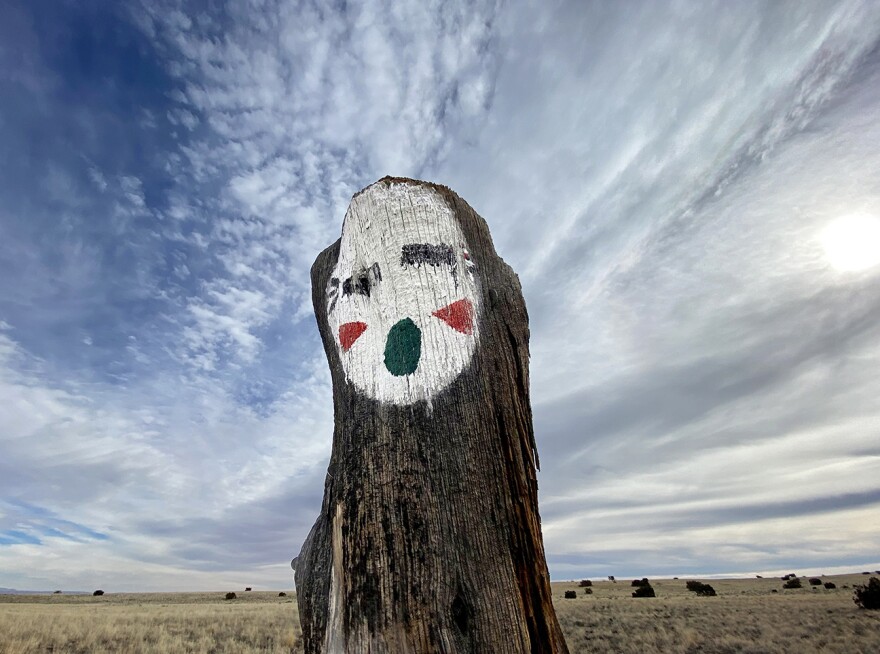 The Wupatki Spirit Totem features three enigmatic apparitions painted onto wooden posts just off Highway 89 north of Flagstaff. The origin of the ghostly faces remains a mystery for many.