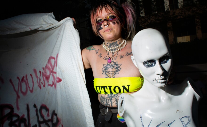 Xochitl Miranda holds a mannequin that reads “keep laws off my body” at a pro-choice protest in Downtown Dallas, Texas on June 25.