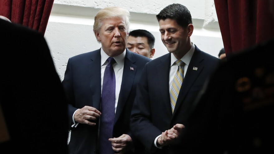 President Trump and House Speaker Paul Ryan, R-Wis., leave a meeting with House Republicans on Thursday, shortly before the House approved a GOP tax overhaul plan.