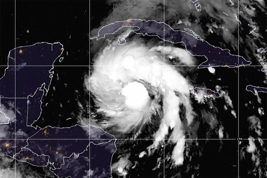 A U.S. National Oceanic and Atmospheric Administration (NOAA) satellite image Monday morning shows Hurricane Ian moving north and straight for western Cuba as it strengthens into a major storm.