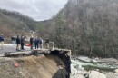 U.S. Department of Transportation Secretary Sean Duffy along with Gov. Josh Stein, Sens. Thom Tillis (R) and Ted Budd (R), Rep. Chuck Edwards (R) and other local officials survey the damage to I-40 near the Tennessee line on Feb. 10, 2025.