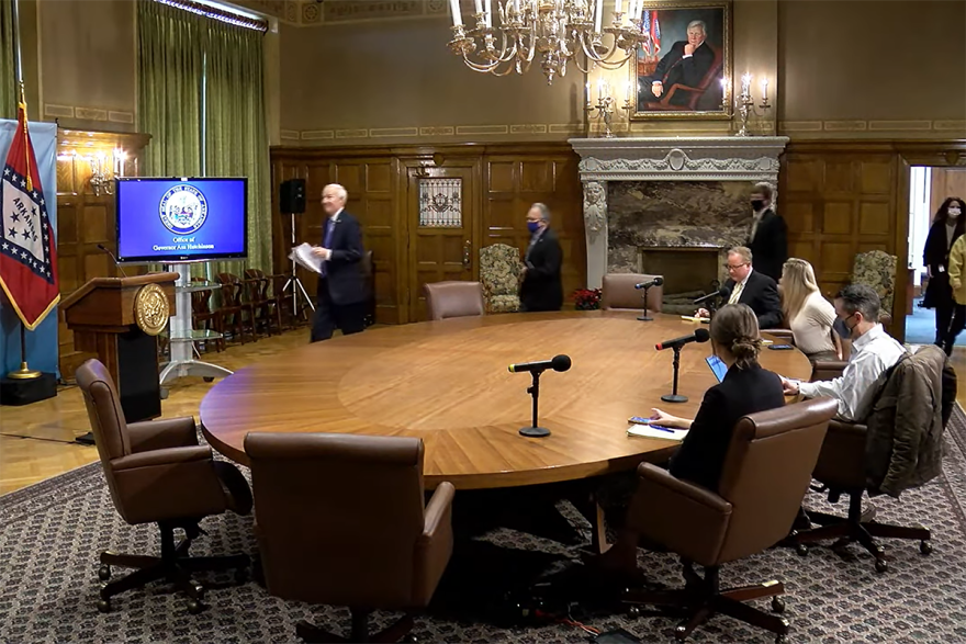 Gov. Asa Hutchinson, Health Secretary Dr. Jose Romero and Education Secretary Johnny Key enter Tuesday's press conference at the state Capitol.