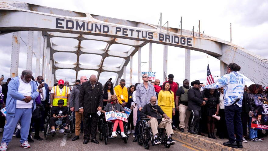 People march over the Edmund Pettus Bridge on the 61st Bloody Sunday Anniversary, Sunday, March 8, 2026, in Selma, Ala. (AP Photo/Mike Stewart)