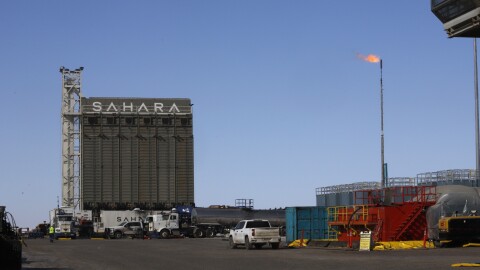 A gas flare burns at the drilling rig for the Pikka Project.
