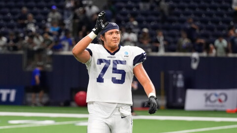 FILE - Dallas Cowboys offensive tackle Shiyazh Pete waves to fans after an NFL football practice on Aug. 26, 2026, in Frisco, Texas. (AP Photo/Tony Gutierrez, File)