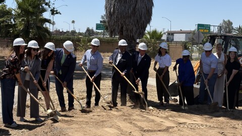 Community members, organizers, and local leaders hold shovels to mark the groundbreaking of Davu Village in Fresno on the morning of Wednesday, June 24, 2026.
