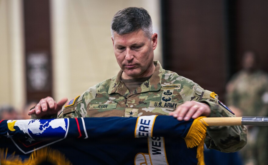 Army General Joseph A. Ryan, the incoming leader of the Western Hemisphere Command, uncases the command colors during a ceremony at Fort Bragg, N.C., Dec. 5, 2025. The new command combines U.S. Army Forces Command, U.S. Army North, and U.S. Army South.