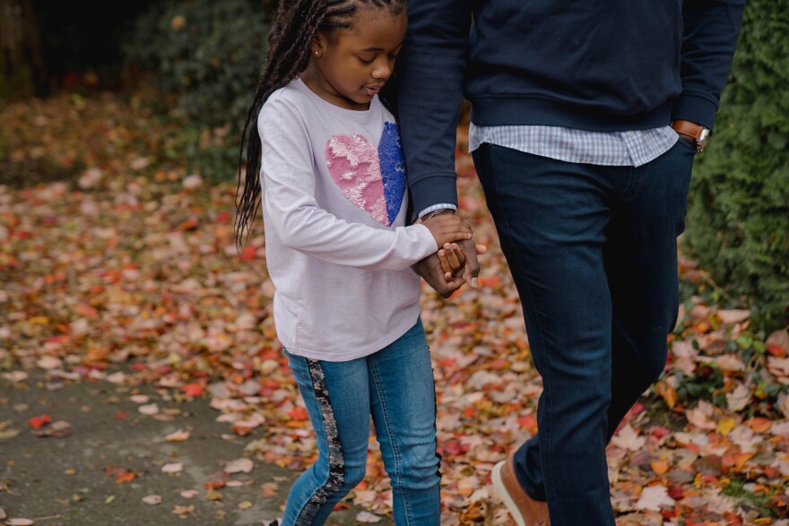 Taylor Station walks with her dad.