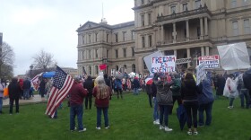 People protest at the Michigan State Capitol on April 30, 2020.