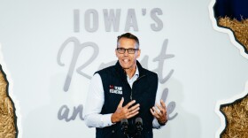 a man speaks at a podium