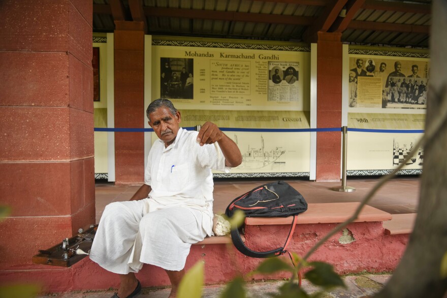 For an hour a week, Musaddilal Gupta, 76, visits the garden where Gandhi died and spins his own thread on a spinning wheel, as Gandhi taught.