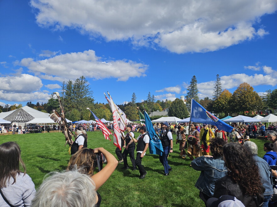 The Grand Entry of The Second Homelands PowWow: Tending the Fire is lead around the sacred circle by veterans of the Stockbridge-Munsee Mohican people.