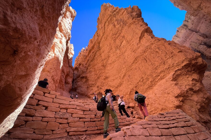 Hikers ascend a trail in Bryce Canyon National Park, June 1, 2024. All of southern Utah’s national parks have seen a dip in visitation this summer.