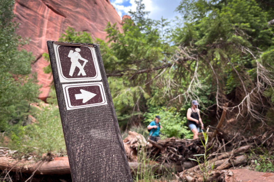 Visitors hike a trail in the Kolob Canyons section of Zion National Park, June 3, 2023.