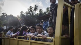 Evacuee children on a truck as they head off to a temporary school on Sept. 27, 2017 in Karangasem regency, Bali, Indonesia. Indonesian authorities declared a state of emergency as hundreds of tremors are recorded at Bali's Mount Agung volcano, and around 90,000 villagers evacuated their homes. Authorities issued travel warnings for the popular tourist destination and warned Mount Agung has the potential to erupt imminently although flights to Bali and its main tourist areas remain unaffected for now. (Ulet Ifansasti/Getty Images)