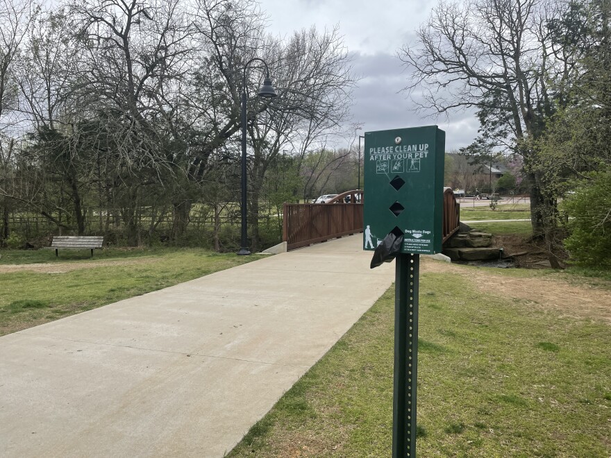 One of the waste bag stations along the sidewalk in Gulley Park.