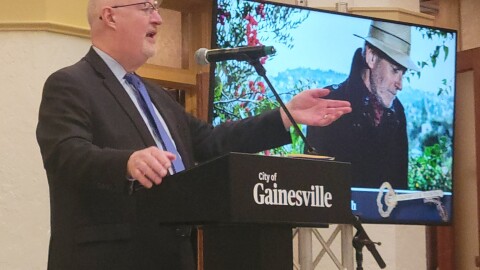 Gainesville Mayor Harvey Ward speaks to the audience during the State of the City address at the Thomas Center on Wednesday, Feb. 18, 2026.