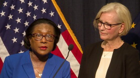 Marion County Health Department Director Virginia Caine and State Health Commissioner Kris Box speak at a press conference Friday. They say an adult man was at a conference in Boston where he was exposed to COVID-19.