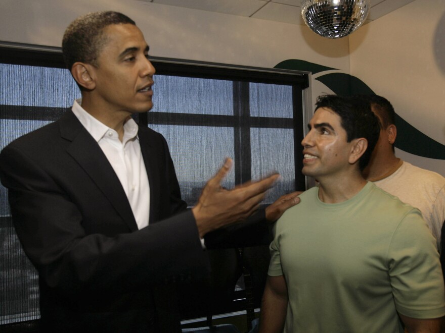Sotelo chats with then-Senator Barack Obama in 2007 after an interview on his radio show <em>Piolín por la Mañana</em>.