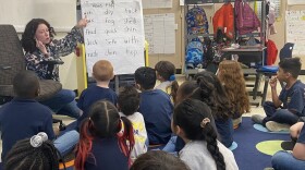 Teacher Ivy Sullivan works on reading skills with kindergarten students at Adelante charter school on Thursday, April 27, 2023 in Indianapolis.