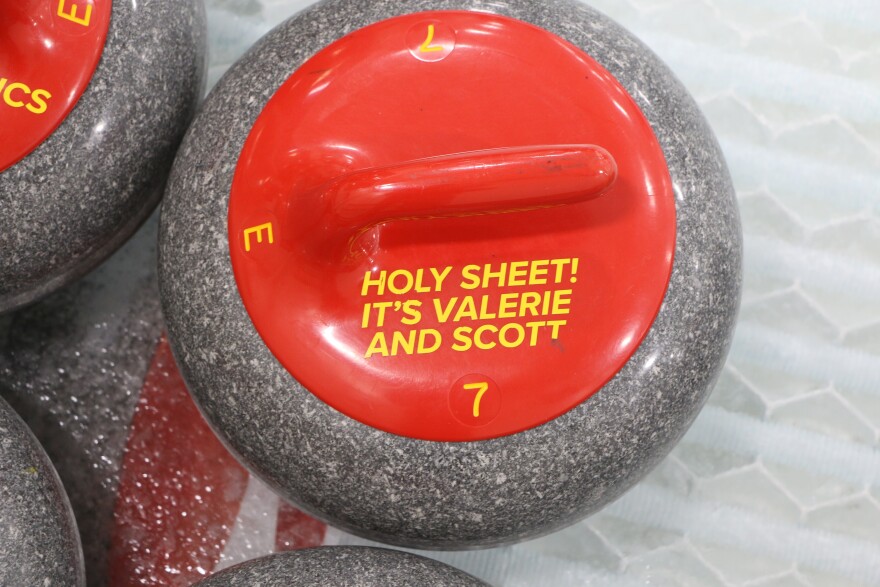 A punny curling rock at rest on a curling sheet. (Austin Rowlader, IPR News)