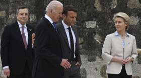In this Friday, June 11, 2021 file photo, from left, Italian Prime Minister Mario Draghi, U.S. President Joe Biden, French President Emmanuel Macron and European Commission President Ursula von der Leyen walk together during the G7 Summit, in Carbis Bay, Cornwall, England.