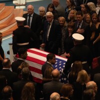 Onlookers attend a noon service at First Baptist Church in Columbia for Lindsey Graham.