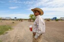 Javier Sanchez stands in his front yard in Lobo, Texas, as trucks delivering dirt to a new “man camp” for border wall construction workers drive past. “We lost all our tranquility,” he said.