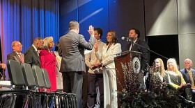 State Representative Ryan Hatfield administers the oath of office to Stephanie Terry