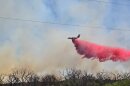 Large airtanker drops retardant on the Bell Fire in Dickens County, Texas.