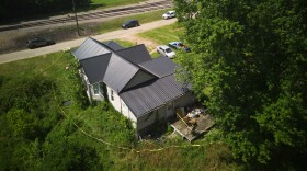 Police tape surrounds a home where authorities say they removed 16 children and arrested four adults in Hamden, Ohio, Wednesday, July 1, 2026. (AP Photo/Carolyn Kaster)