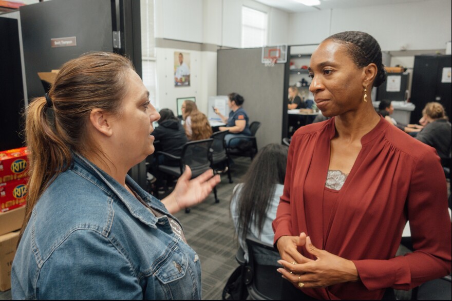 Clinical psychologist Miatta Snetter (right) speaks to Marine Corps veteran Sherry Pope at the Fullerton College Veterans Resource Center.  Snetter says woman sometimes feel uncomfortable around male veterans at the VA.