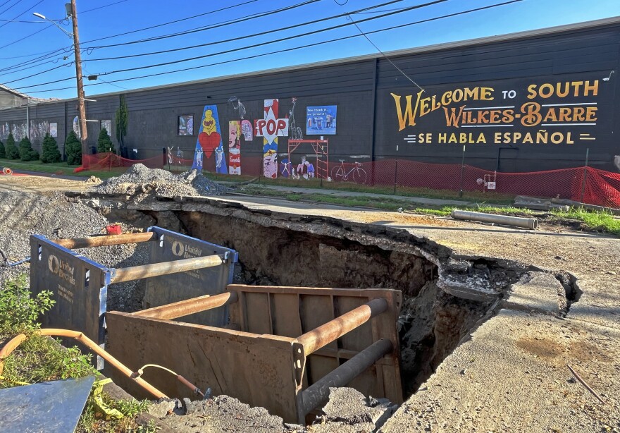 Work continues to repair two sinkholes on Horton Street, Wilkes-Barre, including this one which opened up between Church and Warren streets on July 14. Mayor George Brown and other officials held a community meeting Monday evening, July 28 to update residents on the status of the work, which Brown said is expected to continue for at least another month.