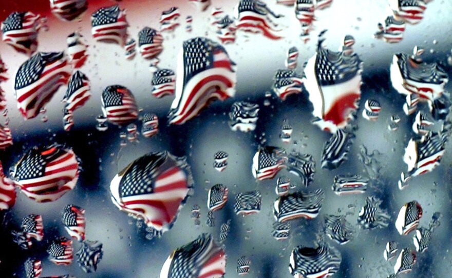 The soggy stars and stripes are reflected in the droplets of freezing water on a car's side view mirror along Rt. 6A in Brewster as the flag flaps in a Cape Cod wind. Photographer Steve Heaslip said that he captured the shot through his rearview mirror. 
