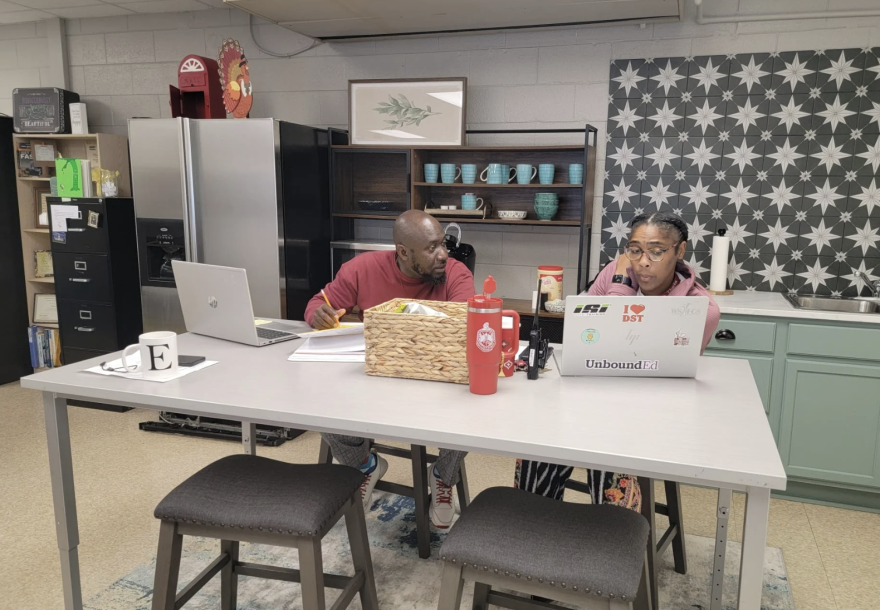 Easton Elementary School teachers work on their laptops in the newly renovated teachers' lounge. (Image courtesy of Community for Public Schools)