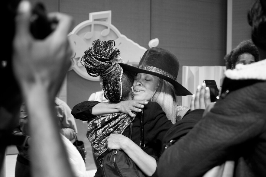 Erykah Badu greets an audience member after her talk on April 30, 2013, in New York.