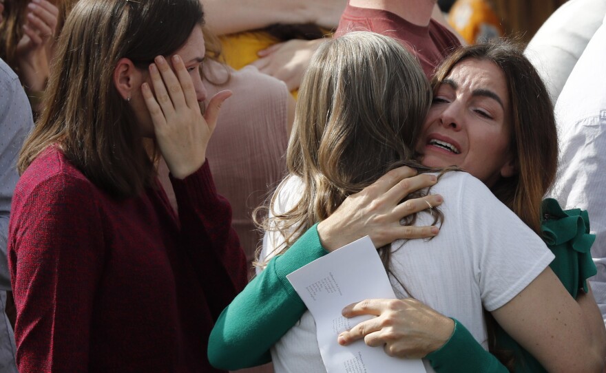 People attend the funeral of Dawna Ray Langford, 43, and her sons, Trevor, 11, and Rogan, 2, who were killed in an ambush. The funeral was at a family cemetery in La Mora, Sonora state, Mexico, on Thursday.