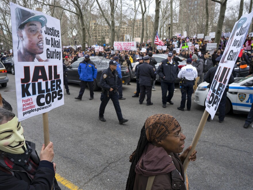 A group of counterprotesters stand across the street from hundreds of protesters attending a rally supporting Peter Liang on Feb. 20 in Brooklyn, N.Y.