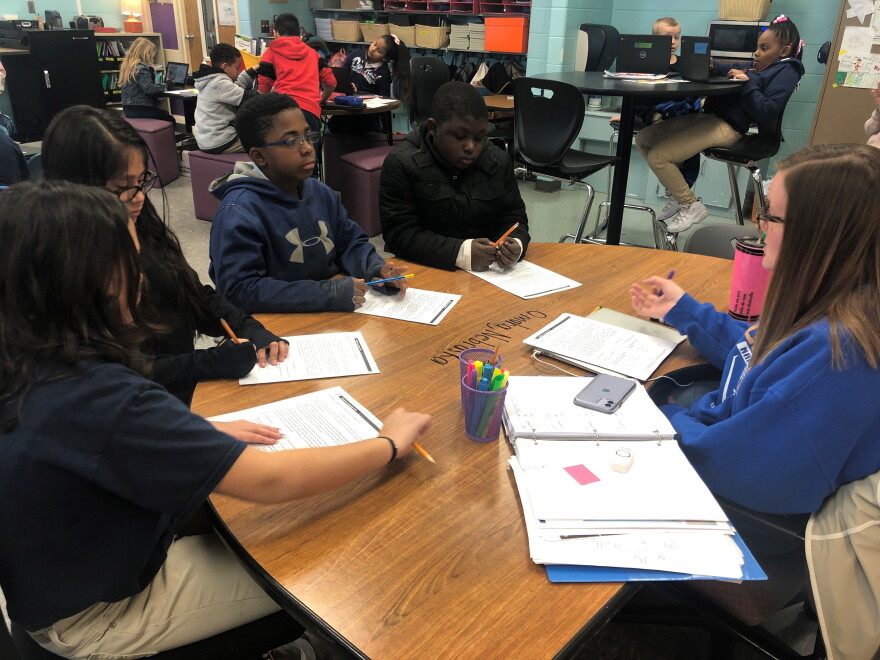 Students in Felicia Bowles' third grade class at Pitcher Elementary work on an assignment on March 6, 2020, the week before schools closed due to the pandemic. Even when teachers are vaccinated, students will be expected to wear masks and practice social distancing because there's no vaccine for kids yet.
