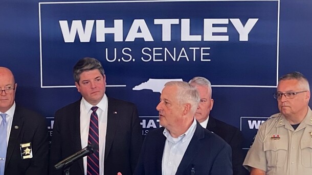 GOP U.S. Senate candidate Michael Whatley speaks at a podium in Harrisburg.