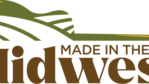 The logo for the Made in the Midwest concert series shows half on an acoustic guitar over the series' name.