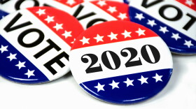 close up of political voting pins for 2020 election on white